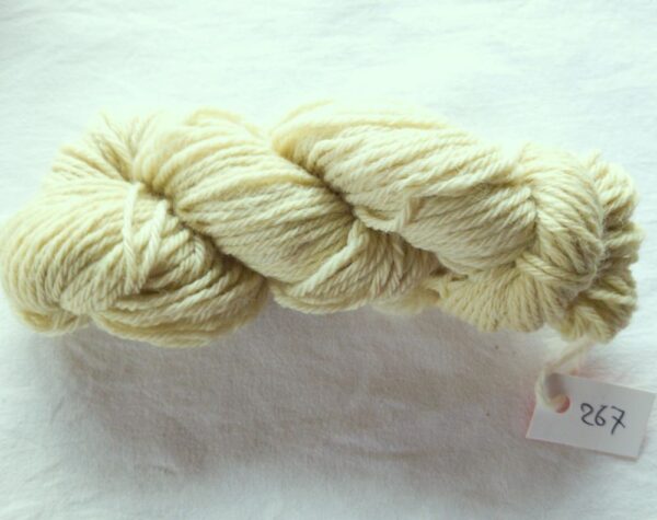 twisted skein of pale olive green yarn