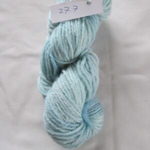 turquoise blue white lighter areas skein of aran weight yarn on a white background with a label 277