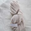 lilac skein of aran weight yarn on a white background with a label 284